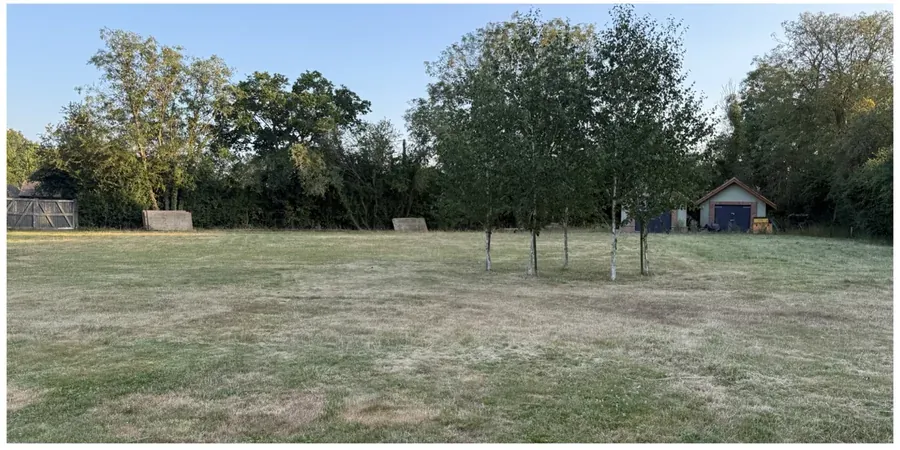 Same large lawn after grass cutting and tidying